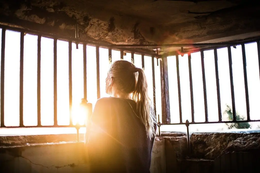 young woman in containment wondering what to do