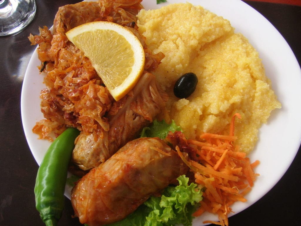 a Romanian dish: Sarmale and Mamaliga.
